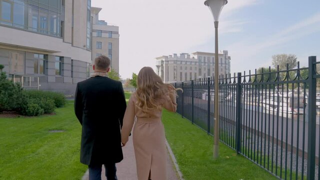 couple in love walking in the park in slowmo