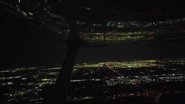 Reflection Of City Skyline In Airplane Wing At Night 002