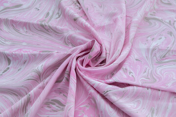 pink top view of base color silk, fabric with pink marble pattern silk, wavy, spiral, crease, swirl, backdrop, cloth background, have copy space for text