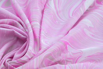 Fototapeta premium pink top view of base color silk, fabric with pink marble pattern silk, wavy, spiral, crease, swirl, backdrop, cloth background, have copy space for text