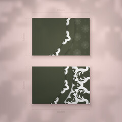 A dark green business card with a luxurious white pattern for your brand.