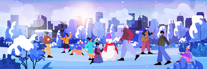 people walking in park men women and children doing winter activities christmas new year holidays celebration