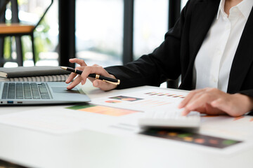 Close up businessman using calculator on documents Unrecognizable finance use calculate about cost at office