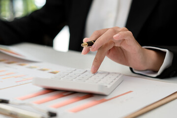 businessman using calculator on desk office business financial accounting concept
