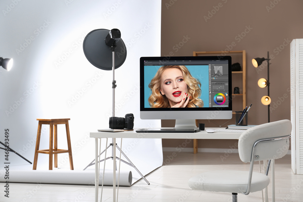 Aufkleber retoucher's workplace. computer with photo editor application, camera and graphic tablet on table in