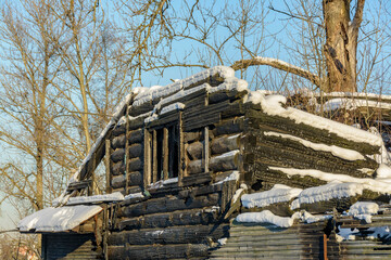 Remains of old wooden houses in the village of Ust-Slavyanka in the area of the construction of a new residential complex.