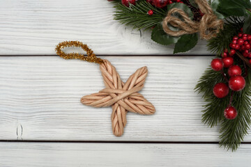 Christmas decoration wicker star made on white background.