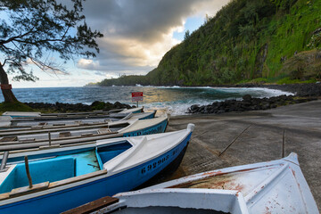 Boats and coast at Anse des Cascades near Sainte Rose city, Reunion Island