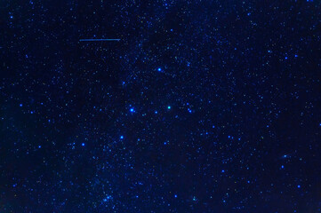 constellation of Orion on background of blue starry sky. Astrophotography of stars, galaxies and...