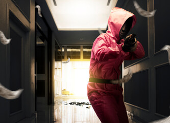 Criminal man in pink guard uniform pointing the shotgun