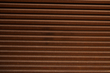 Obraz premium Background of dark brown and oxide shutter door texture