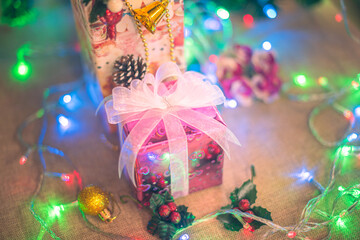 Christmas background with gift boxes, clews of rope, paper's rools and decorations for holidays. Top view with copy space. paper's rools.  DIY gifts, eco decor. Copy space, banner. happy new year 2022