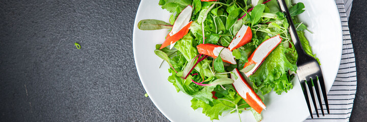 salad crab stick lettuce leaves mix green fresh meal snack copy space food background rustic. top view  © Alesia Berlezova