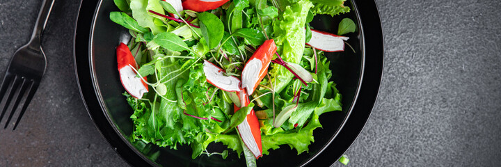 salad crab stick lettuce leaves mix green fresh meal snack copy space food background rustic. top view  © Alesia Berlezova