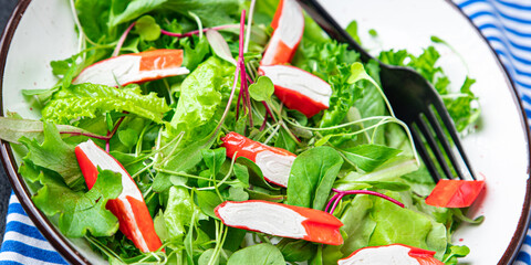 salad crab stick lettuce leaves mix green fresh meal snack copy space food background rustic. top view  © Alesia Berlezova