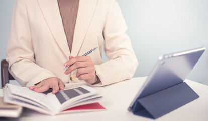 Business woman in suite working with documentary data on white desk at office, Business accounting and financial concept