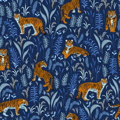 Tigers and plants. Seamless pattern on a blue background.