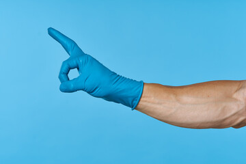rubber gloves on the hands of a man cleaning