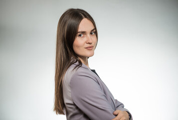 young stylish business woman portrait in office jacket at studio background