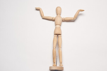 wooden mannequin toy object posing design light background