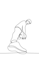 man sits stretching his leg towards the viewer demonstrating his stretch his hand rests on the floor - one line drawing vector. concept of exercise for stretching legs