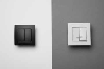 White and black light switches on color background