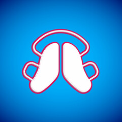 White Dental tooth plate icon isolated on blue background. Vector