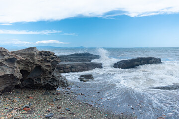 Sea waves hitting the rock. Concept of respect for nature. Copy space.