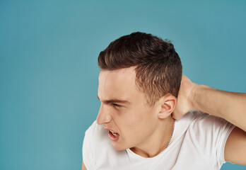 Obraz premium angry man in white t-shirt emotions displeasure Studio