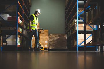 Handsome young male employee concentrating and focusing on work wearing safety helmet and uniform...