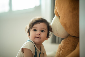 happy son child baby playing at home by supporting with family father and mother