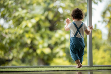 Obraz premium happy son child baby playing at home by supporting with family father and mother