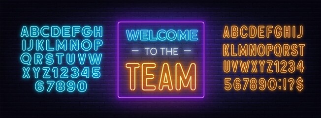 Naklejka premium Welcome to the Team neon sign on a brick background.