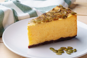 Slice of cheesecake with nuts on plate