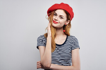 pretty woman wearing a red hat makeup France Europe fashion posing model studio