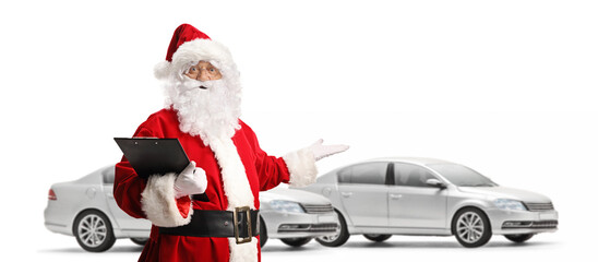 Santa claus pointing at new silver cars and holding a clipboard