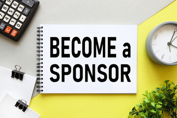 BECOME A SPONSOR. text on notepad on yellow and gray background