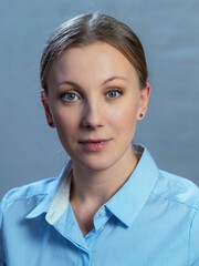 portrait of actress Yanna Mazazolina on a gray-blue background