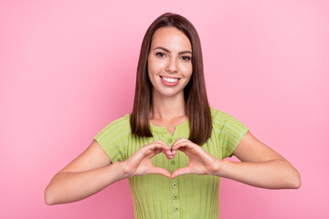 Photo of young lovely lady demonstrate fingers little heart symbol love feelings isolated over pink color background