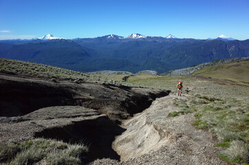 Hiking in Patagonia, Man solo walking up mountainside of volcano Puyehue in Puyehue National Park,...