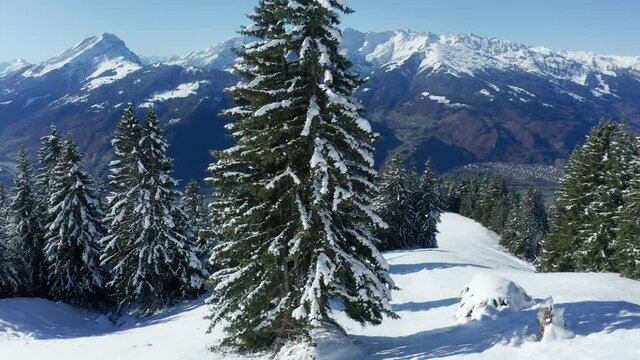a snowy winter mountain landscape in switzerland filmed sidewards