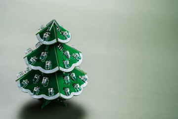 Microchip christmas tree on green background. Holiday banner design. Digital science technology...