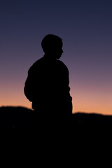 silhouette of a young boy during sunset