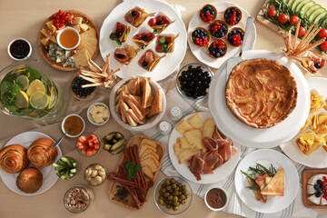 Dishes with different food on table, flat lay. Luxury brunch