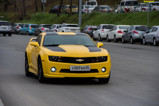 Vladivostok, Russia - November 10, 2021: Chevrolet Camaro  is driving down the city street.