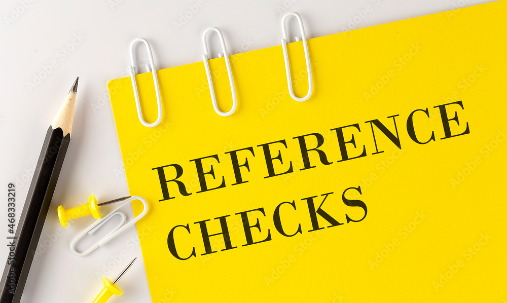 Poster reference checks word on the yellow paper with office tools on white background