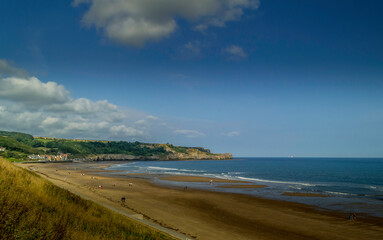 Sandsend beach near Whitby, North Yorkshire on a sunny morning in summer.