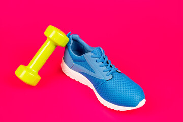 footwear for training. athletic footgear for running. dumbbell sport accessory.