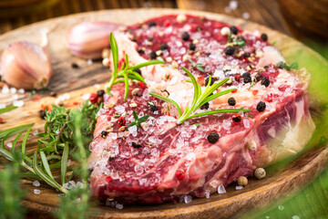 Raw Sreak Meat With Herbs and Spices Close Up View