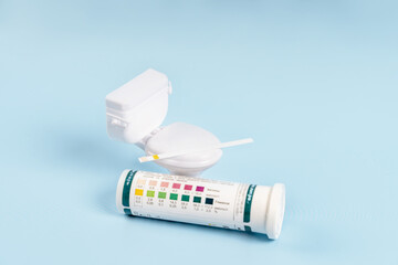 Miniature toilet and strips for detecting ketones and glucose in urine